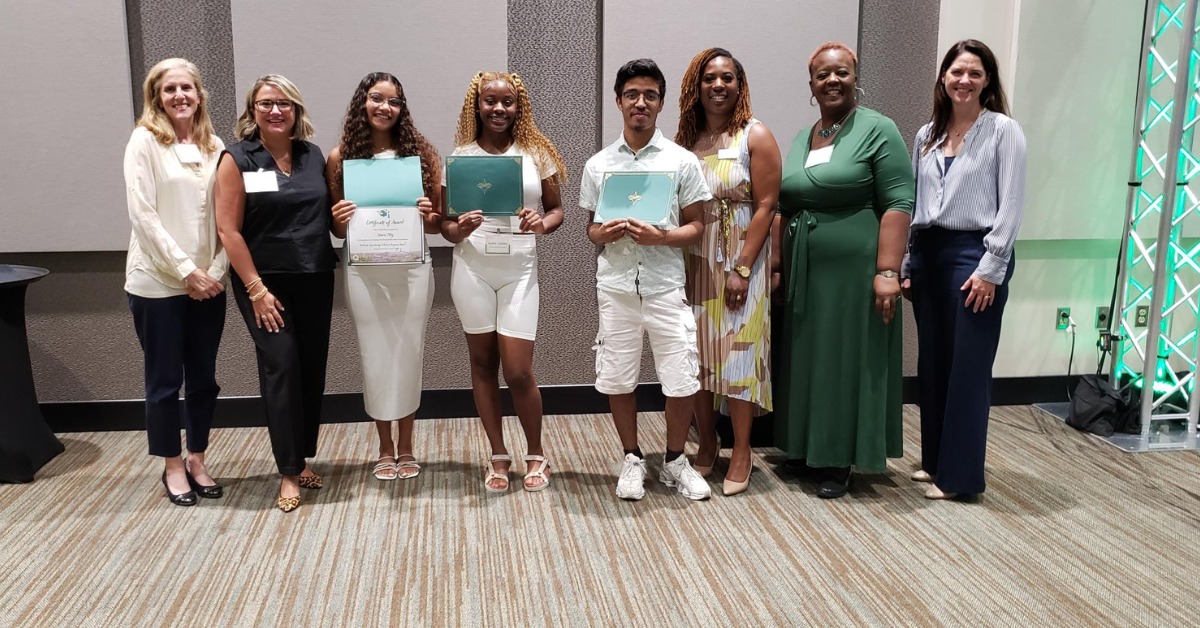 A group of Questa scholars poses with their certificates