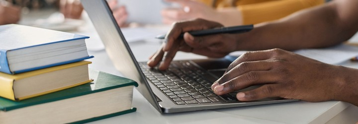 A person typing on a laptop