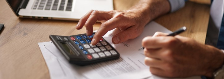 A person using a calculator