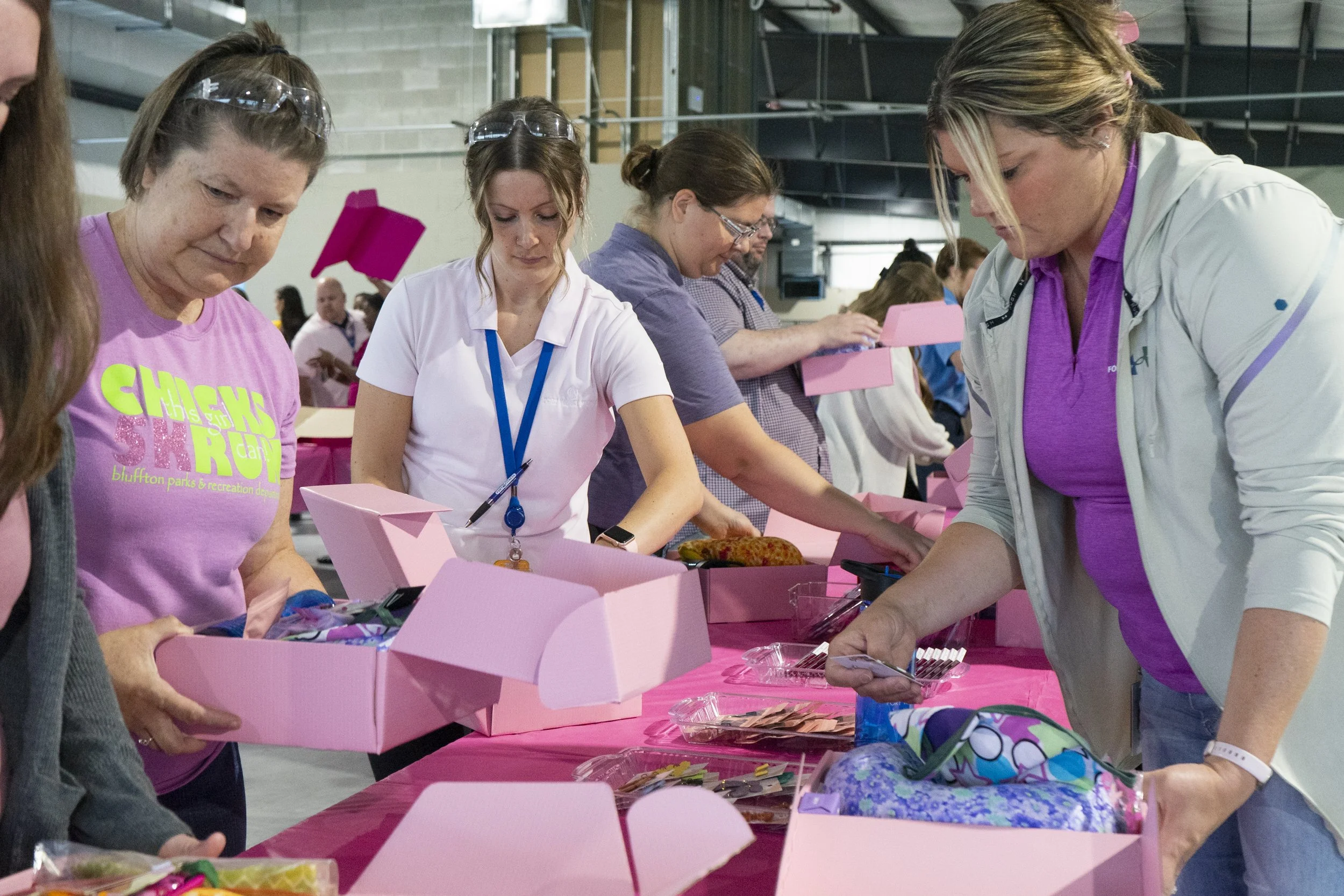 Volunteers filling Breastie Boxes