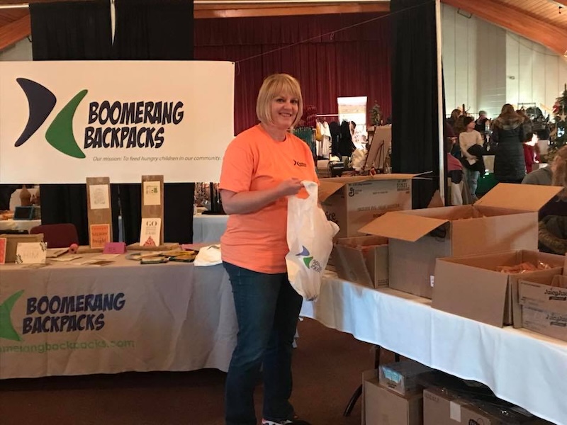 Volunteer working at Boomerang Backpacks