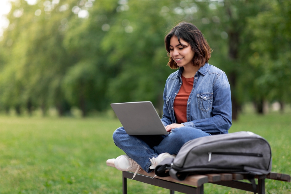 Student applying for college on laptop