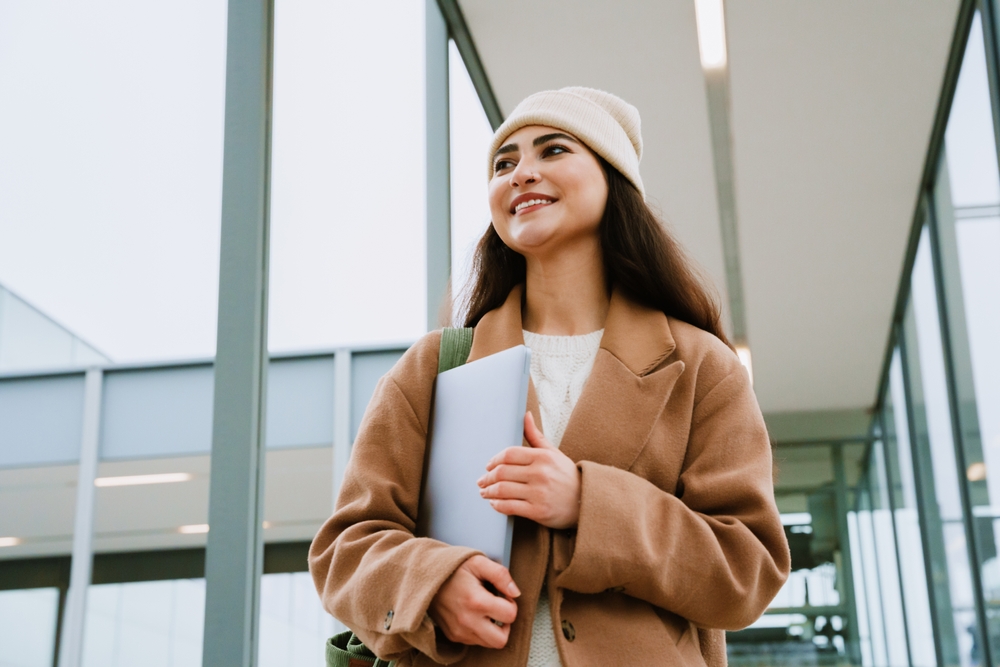 College Student Holding Laptop