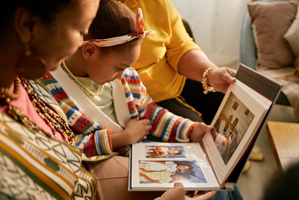 Family looking through a photo album together