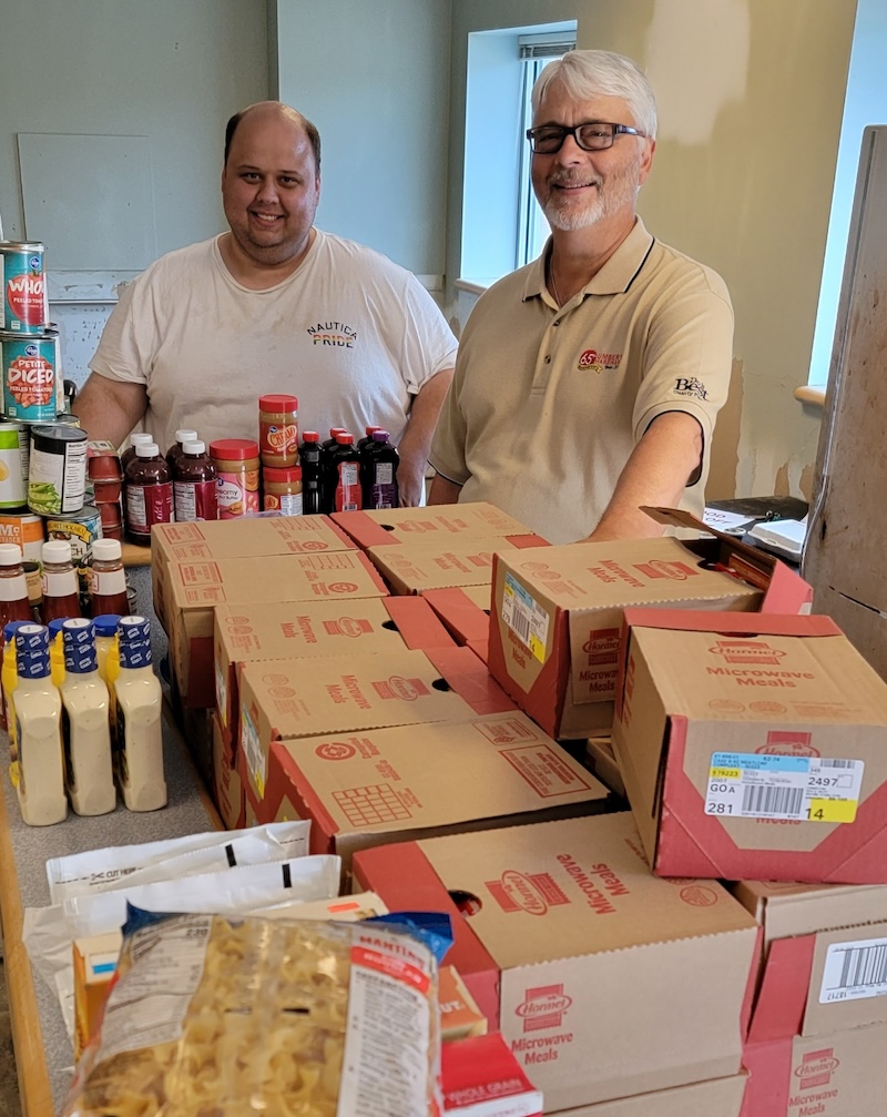 Homebound Meals volunteers packaging food for delivery.