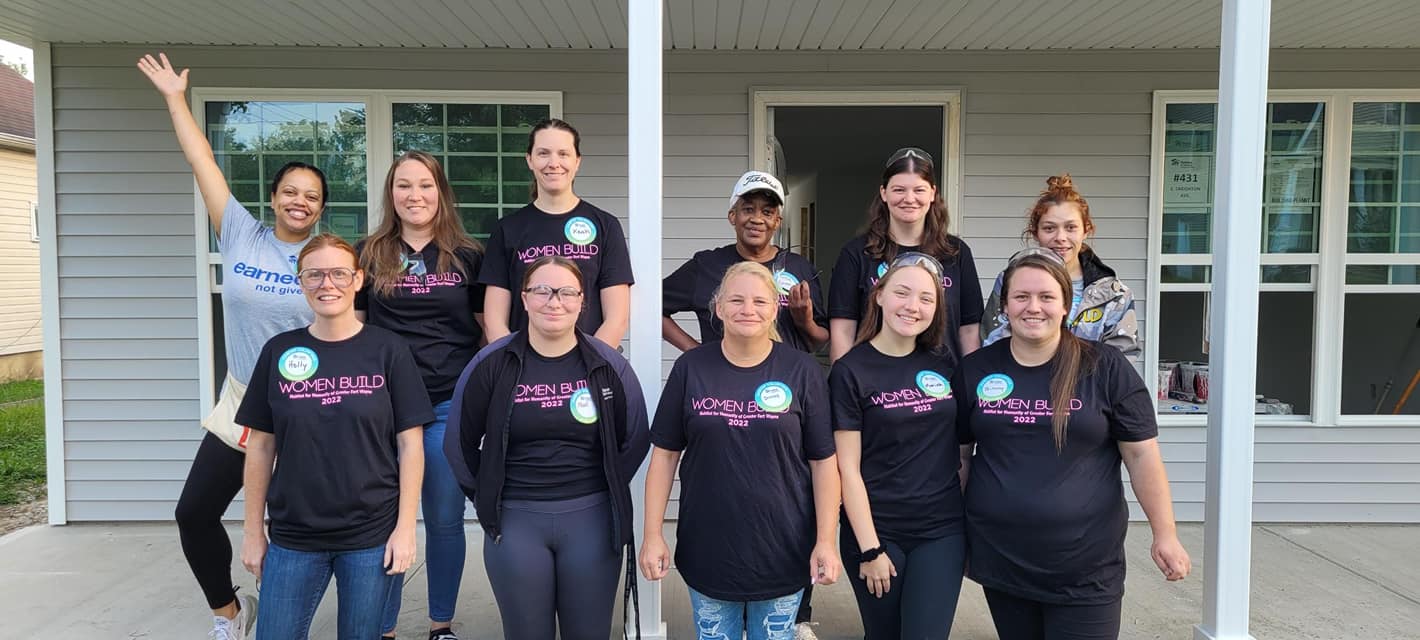 Just Neighbors volunteers at house build.