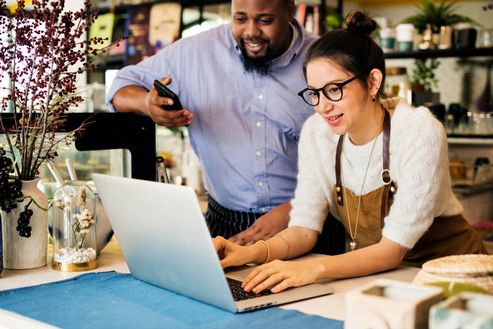 Business owners working on a laptop computer.