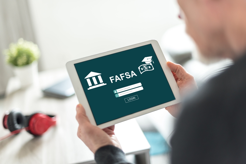 Student filing FAFSA on tablet